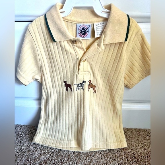 Short sleeve collared shirt. Dog print accent. Buttons partial down - Picture 1 of 1